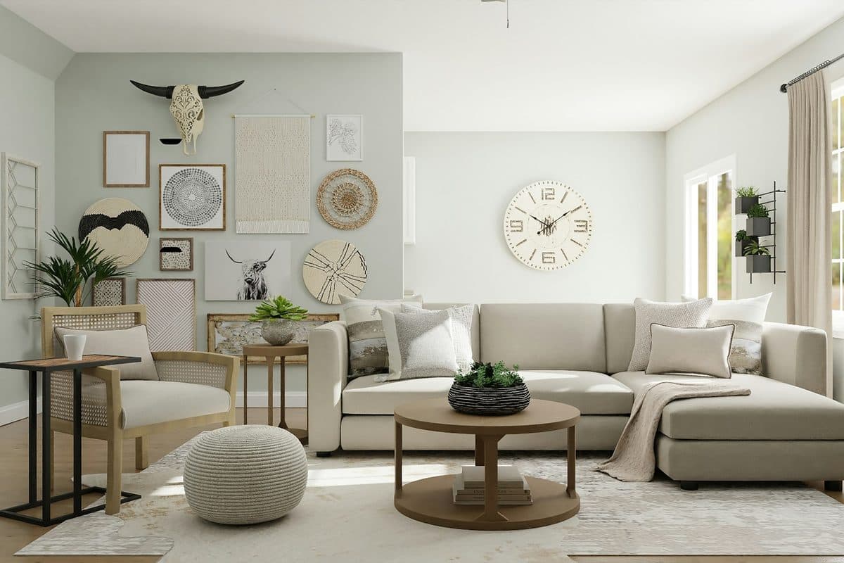 A living room with a mixed gallery wall of frames, round baskets, and a skull above a beige sofa, a large round clock on the next wall, and beige curtains beside a window