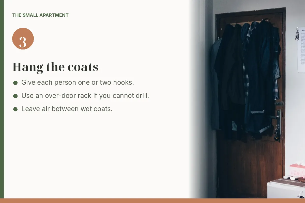 Step card: hang coats on a door. Photo shows jackets hanging on hooks over a bedroom door.